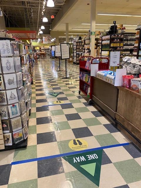 grocery store isle with decals on the floor