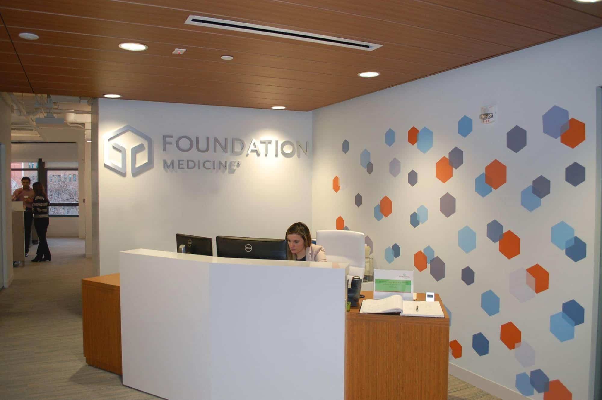 A dimensional letter logo with an aluminum finish at Foundation Medicine’s offices.